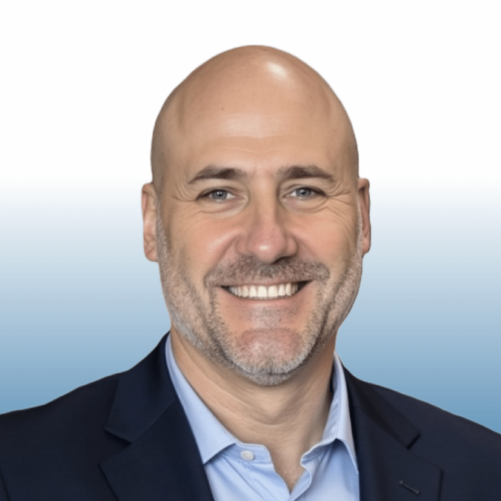 Smiling bald man in a navy blazer, Equity team member headshot